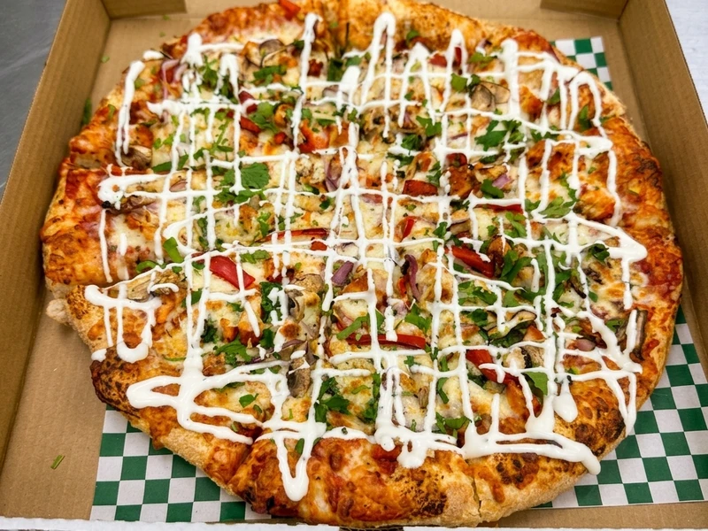 Butter Chicken Special Punjabi-style pizza at Calzone Corner Calgary NE