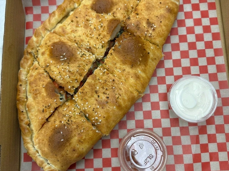 Makhani Fish calzone special at Calzone Corner Takeout Calgary NE