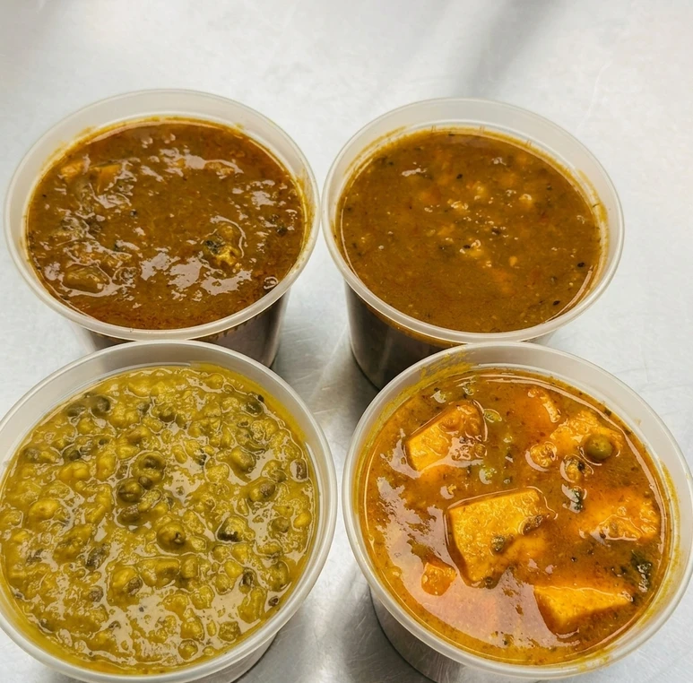 High-protein Indian tiffin meal combo with sabji, roti and rice at Calzone Corner Calgary